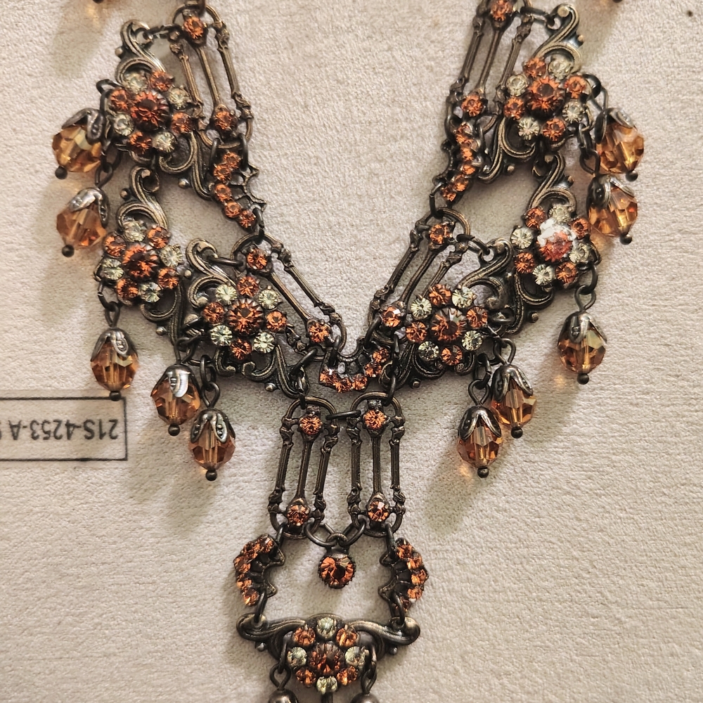 Ornate Floral Necklace with Amber and Bronze Hues
